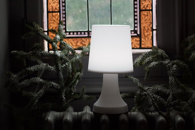 White Table Lamp On White Heater