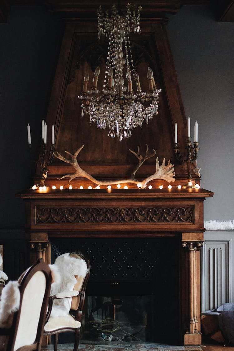 Cozy Vintage Interior With Fireplace And Chandelier