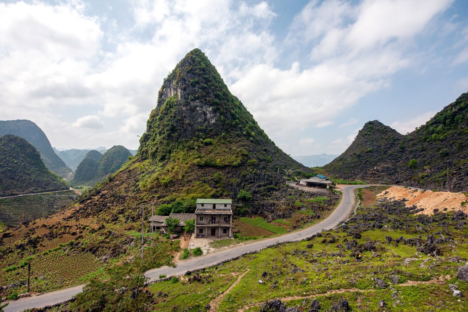 Ha Giang mountain landscape with village and greenery showing the importance of looking slowly