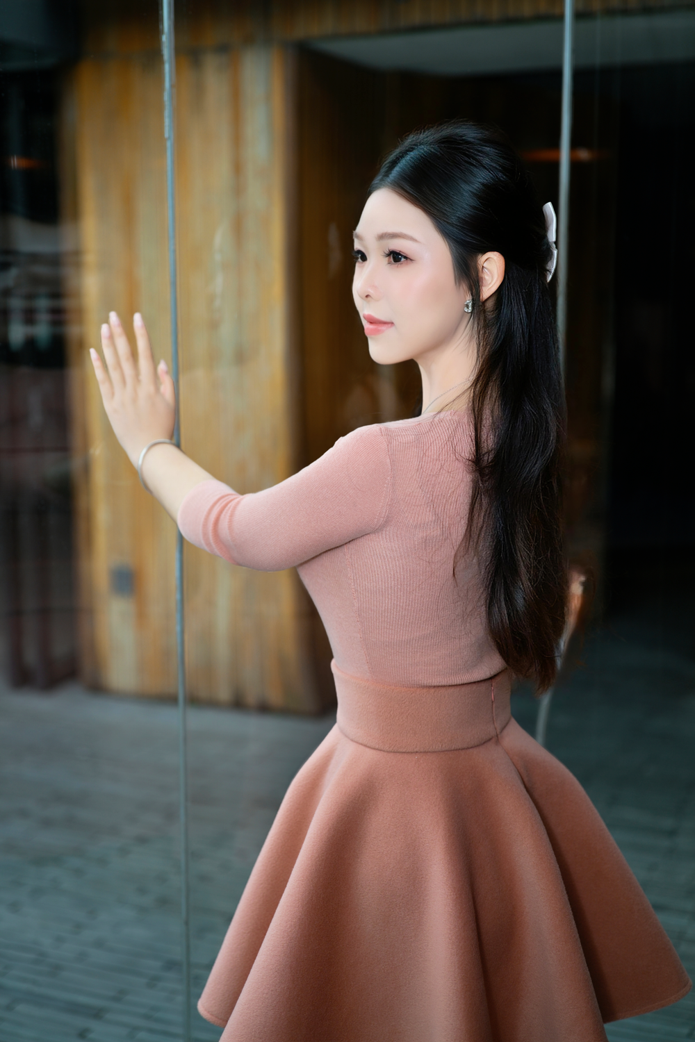 Elegant Portrait of a Woman in Pink Attire · Free Stock Photo