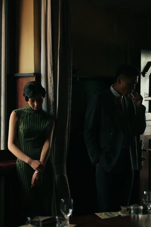 Free A vintage-style portrait of a stylish couple in low light indoors. Stock Photo