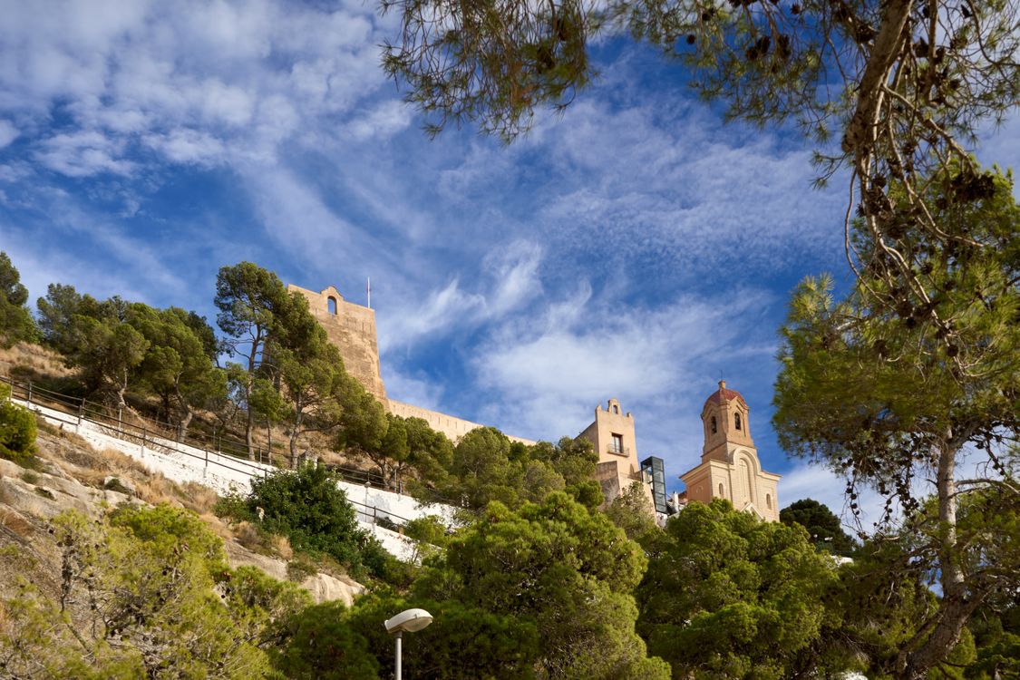 Castle and Church on a Scenic Hill with Blue Sky · Free Stock Photo