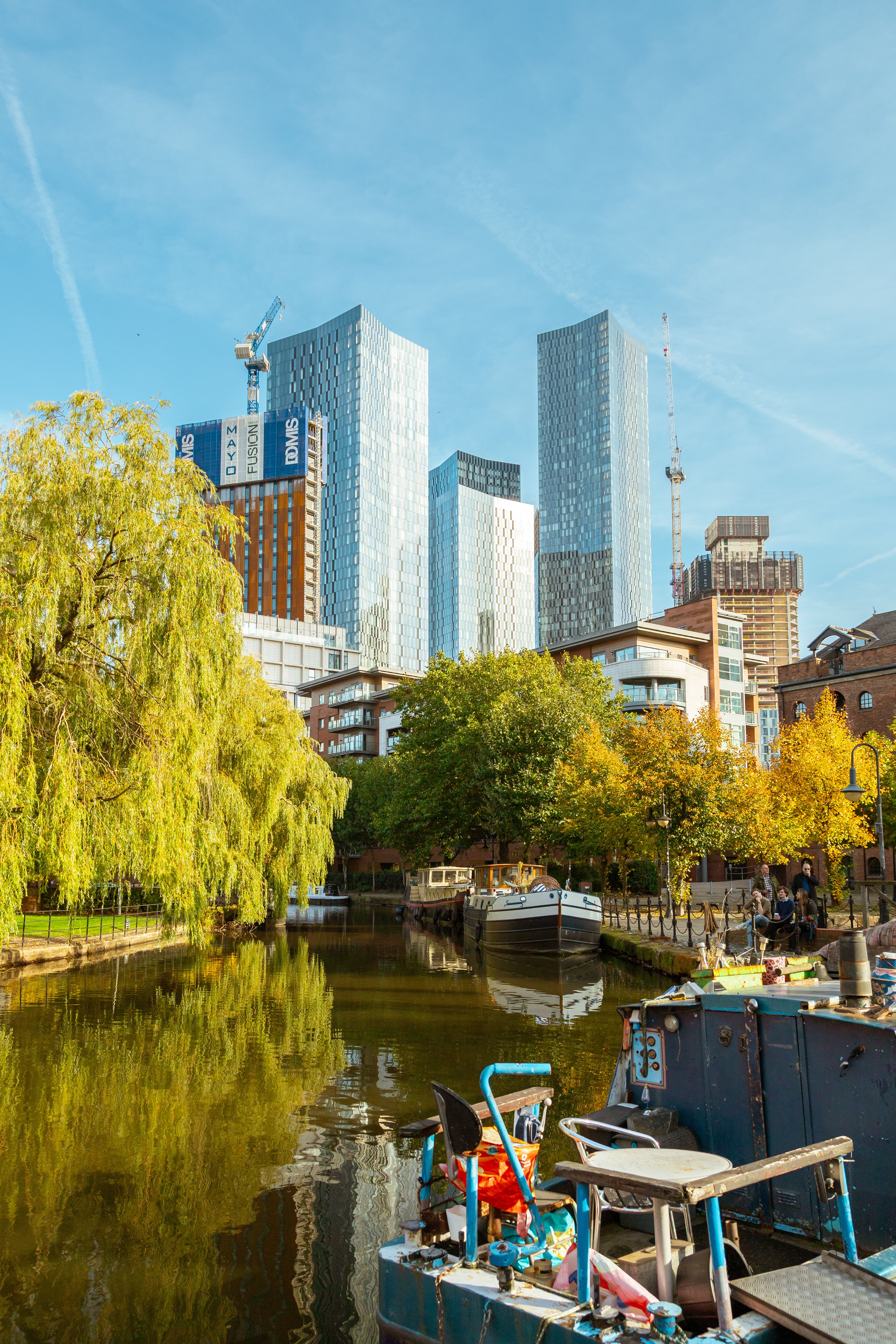 Modern Manchester Skyline by Canal in Fall · Free Stock Photo