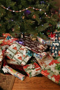 A decorated Christmas tree surrounded by an array of colorful wrapped gifts, creating a festive atmosphere.