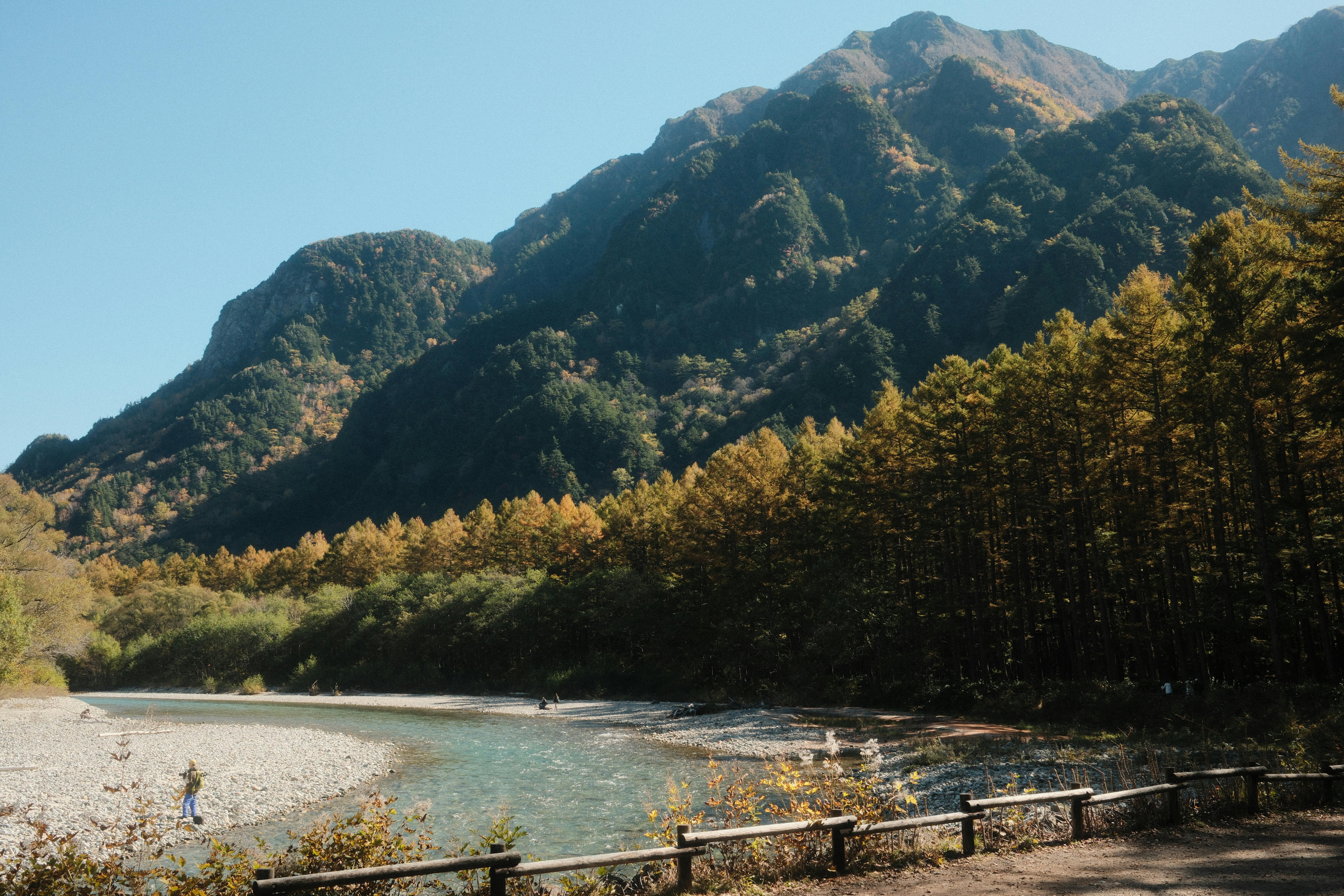 Beautiful view of mountains and a river in Matsumoto, Japan during fall season.