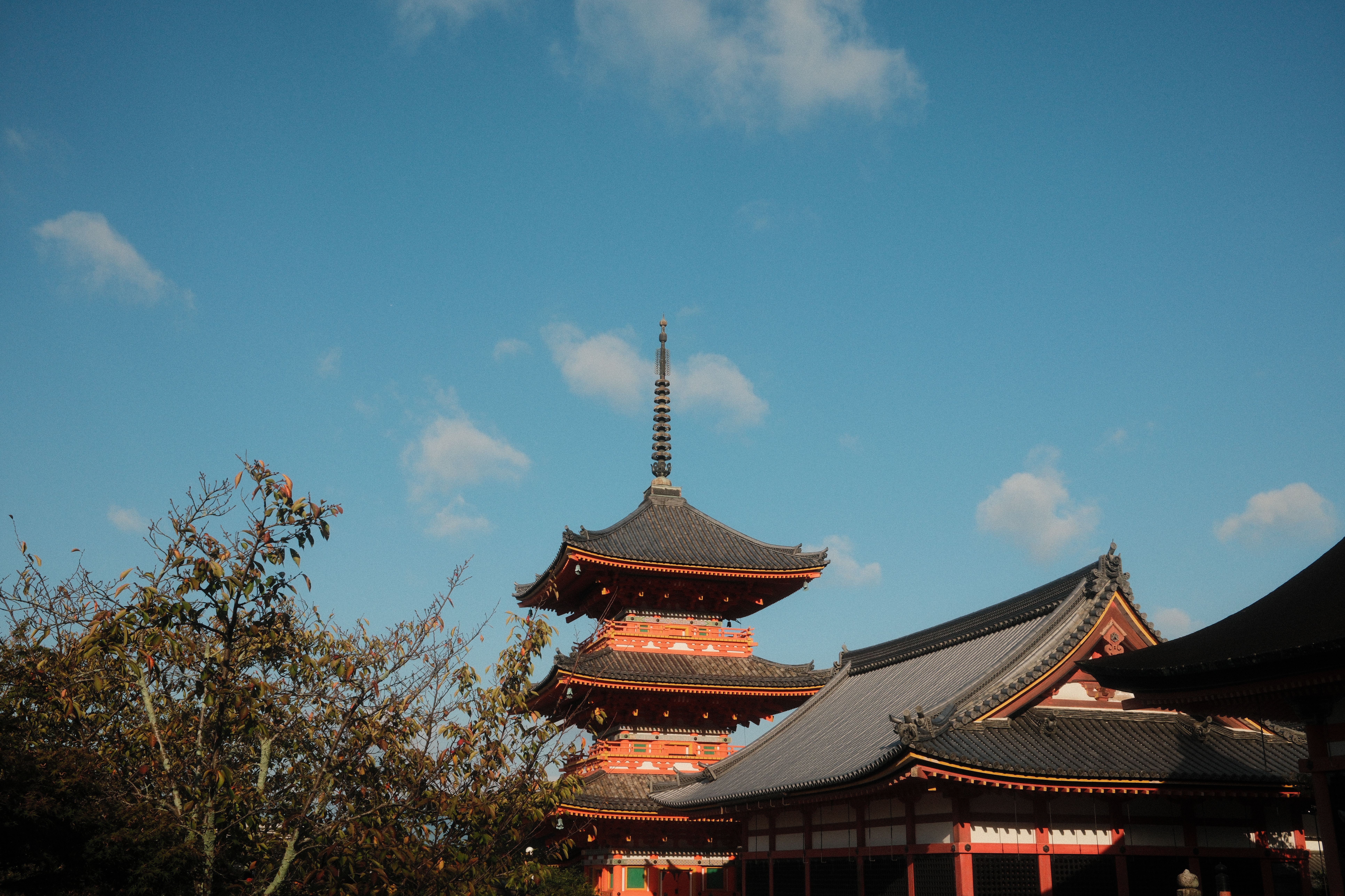 Stunning view of a traditional Japanese pagoda in Kyoto with a clear blue sky.