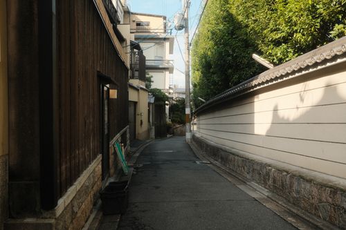 Free Serene alleyway in Kyoto, Japan showcasing traditional architecture and quiet city life. Stock Photo