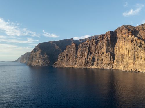 Free A stunning view of the dramatic cliffs of Los Gigantes, Tenerife under a clear sky. Stock Photo
