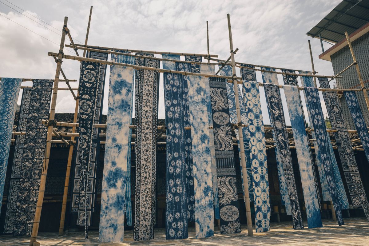 Indigo-dyed cloth hung to dry in a courtyard