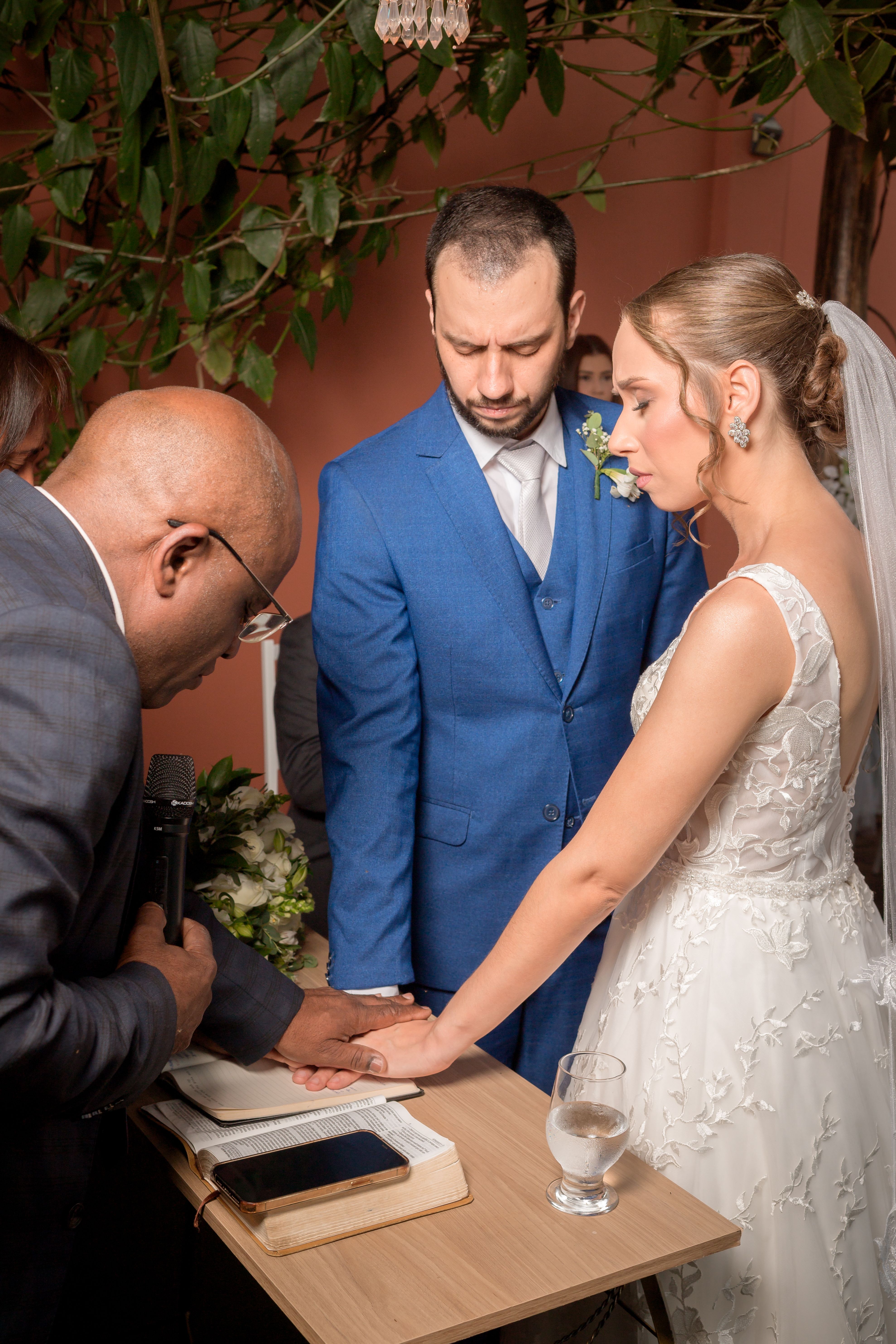 Bride and groom at an intimate wedding ceremony, captured in a moment of solemnity and joy.
