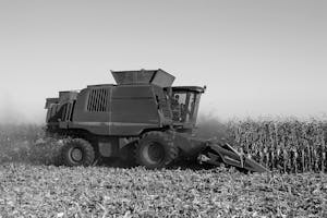 Grayscale Photo of Harvester