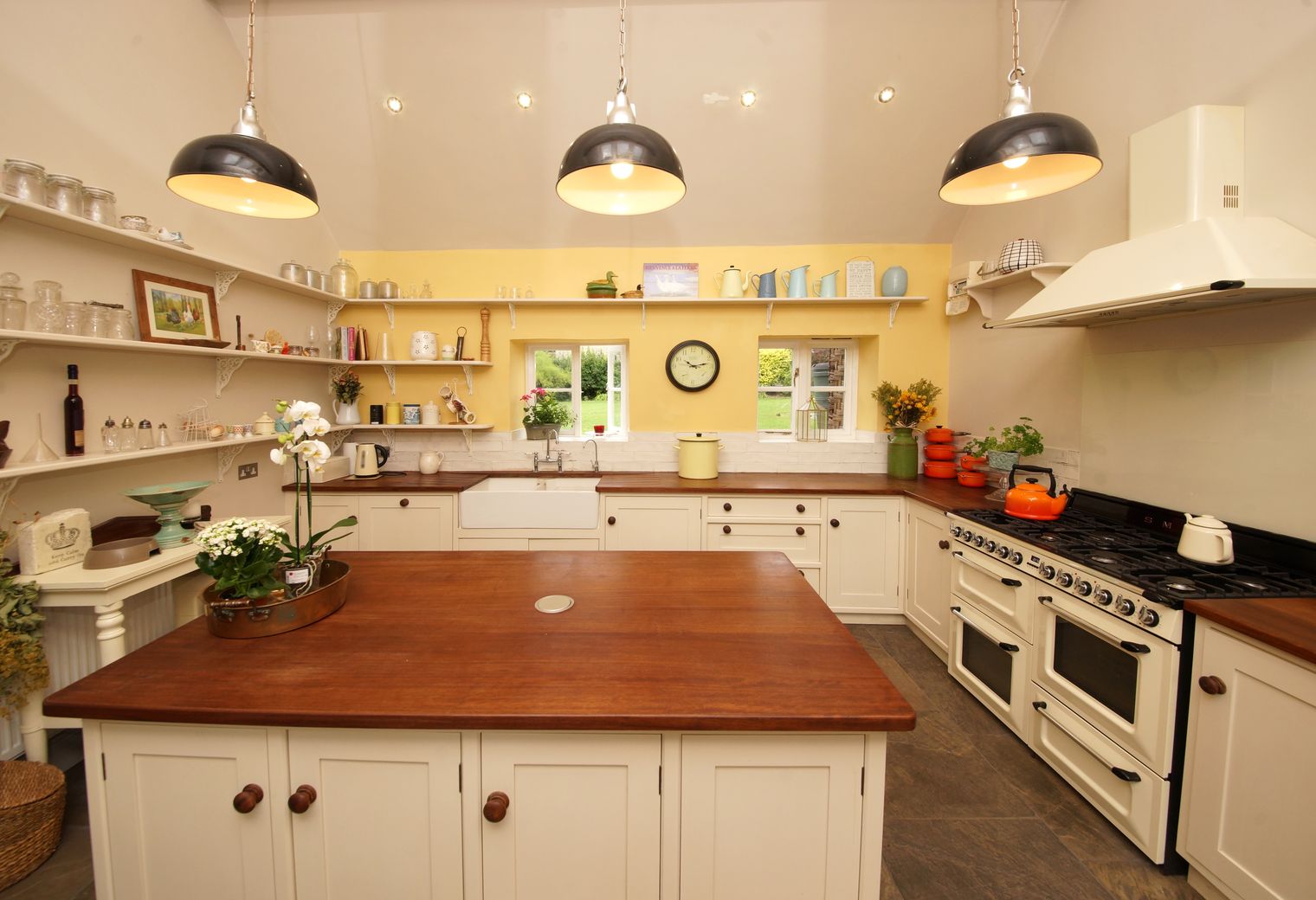 Kitchen Spraying in Grahame Park — careful masking before painting begins