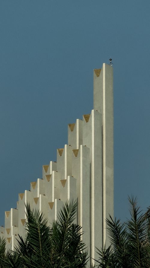 Free A striking modern architectural structure against a clear blue sky in Vũng Tàu, Vietnam. Stock Photo