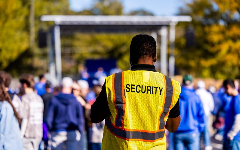 Security steward watching an event crowd