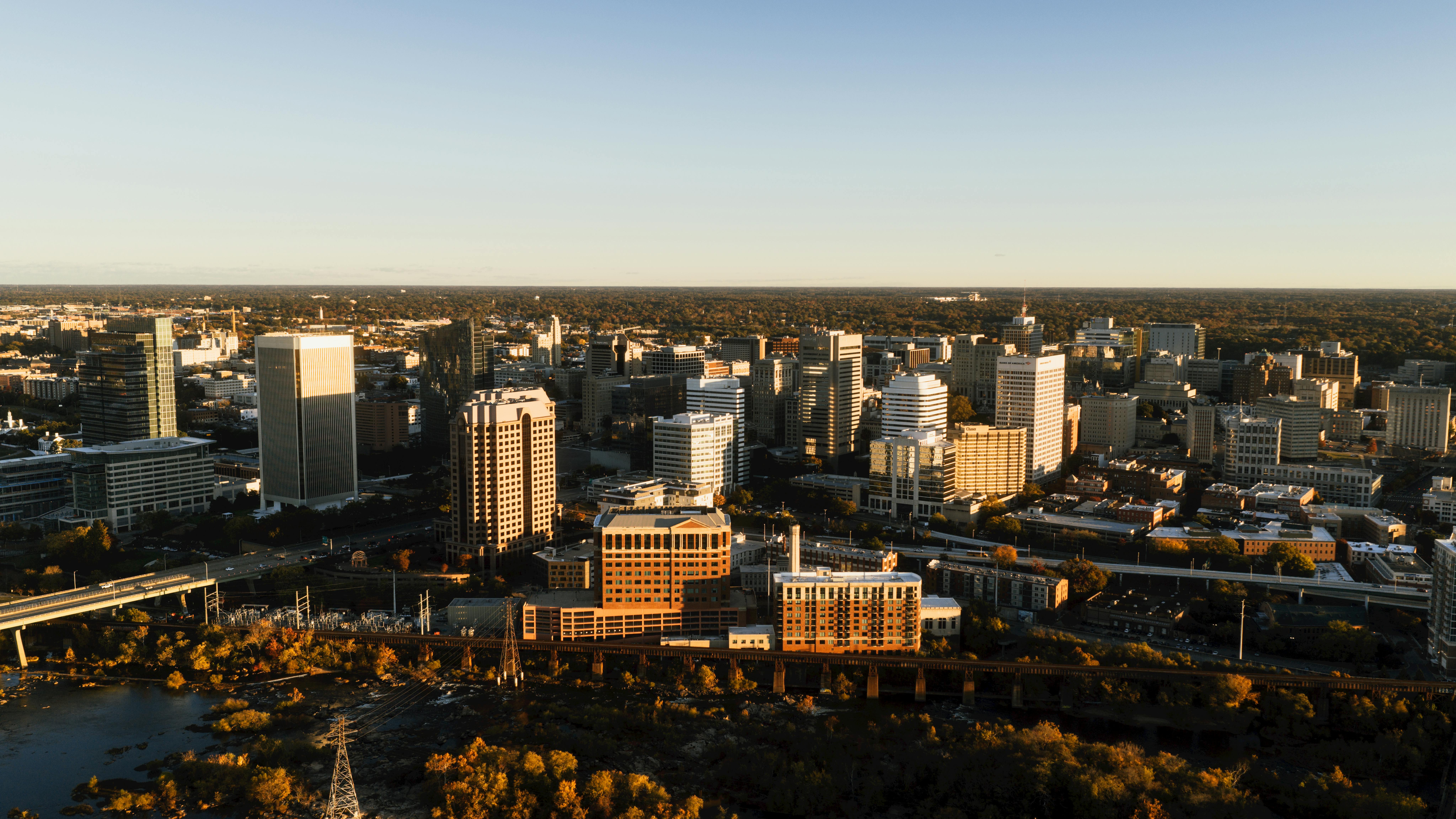 Stunning aerial view of Richmond, Virginia skyline captured at sunset with a warm glow.