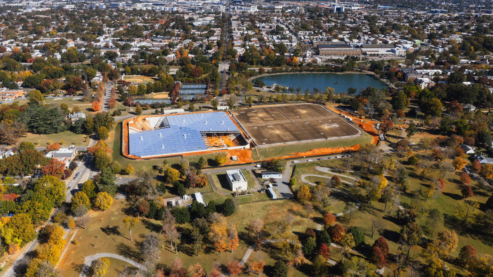 A stunning aerial shot of Richmond, Virginia showcasing its urban layout amidst vibrant fall foliage.