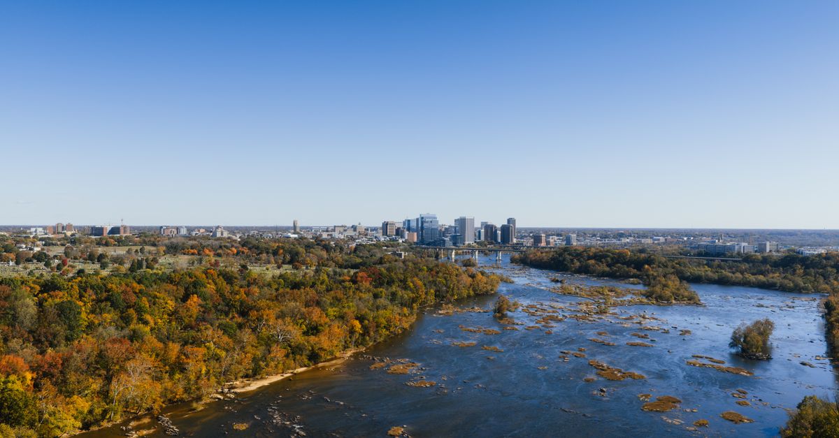 Stunning aerial shot of Richmond, Virginia skyline along with the James River during fall season.