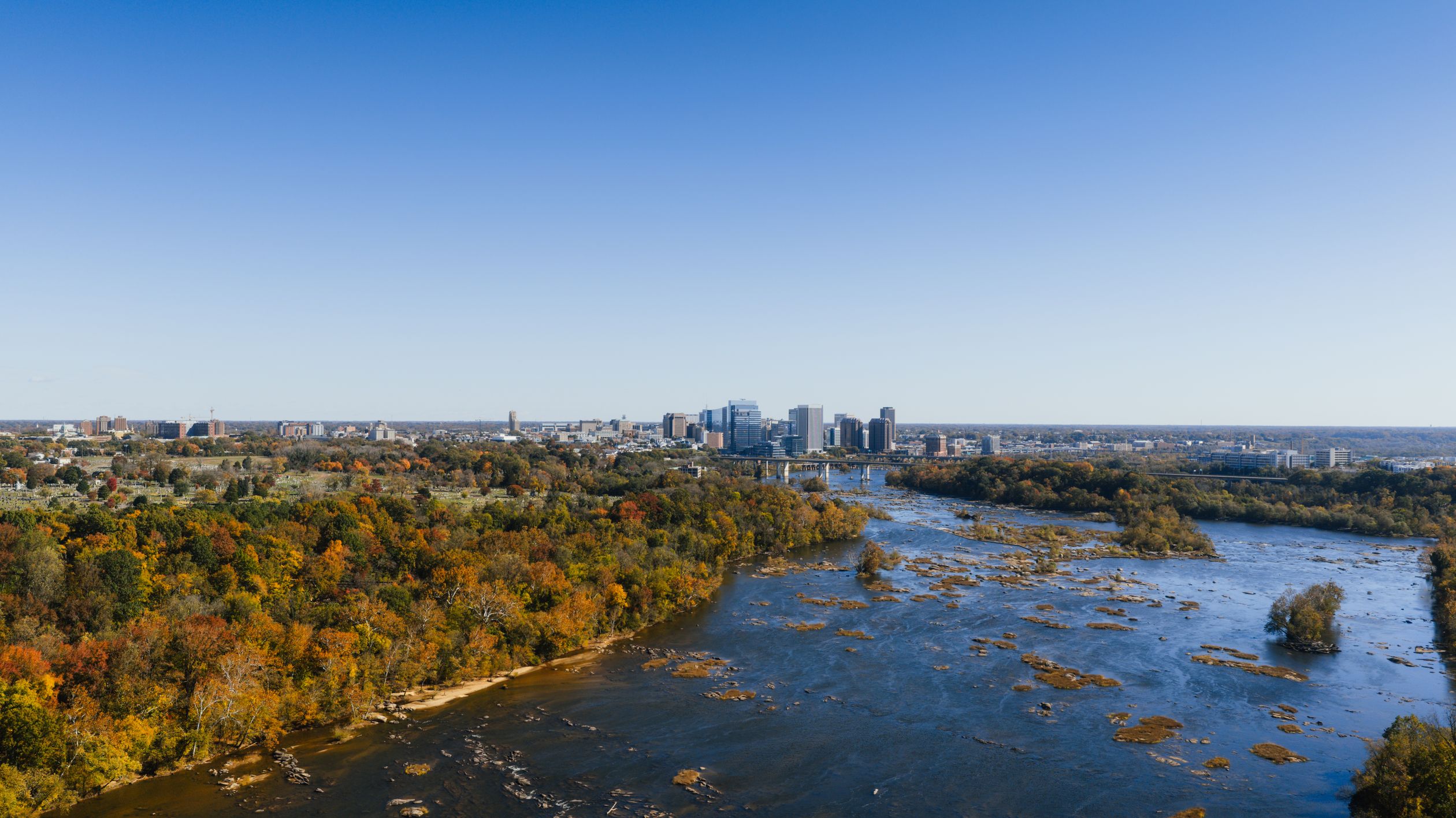 Stunning aerial shot of Richmond, Virginia skyline along with the James River during fall season.