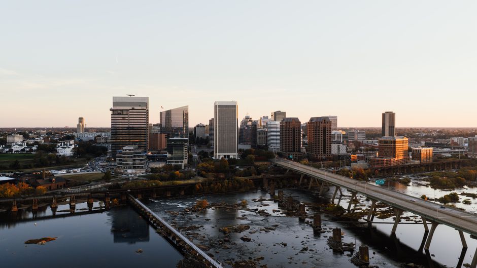 Aerial view capturing the vibrant skyline of downtown Richmond, Virginia at sunset.