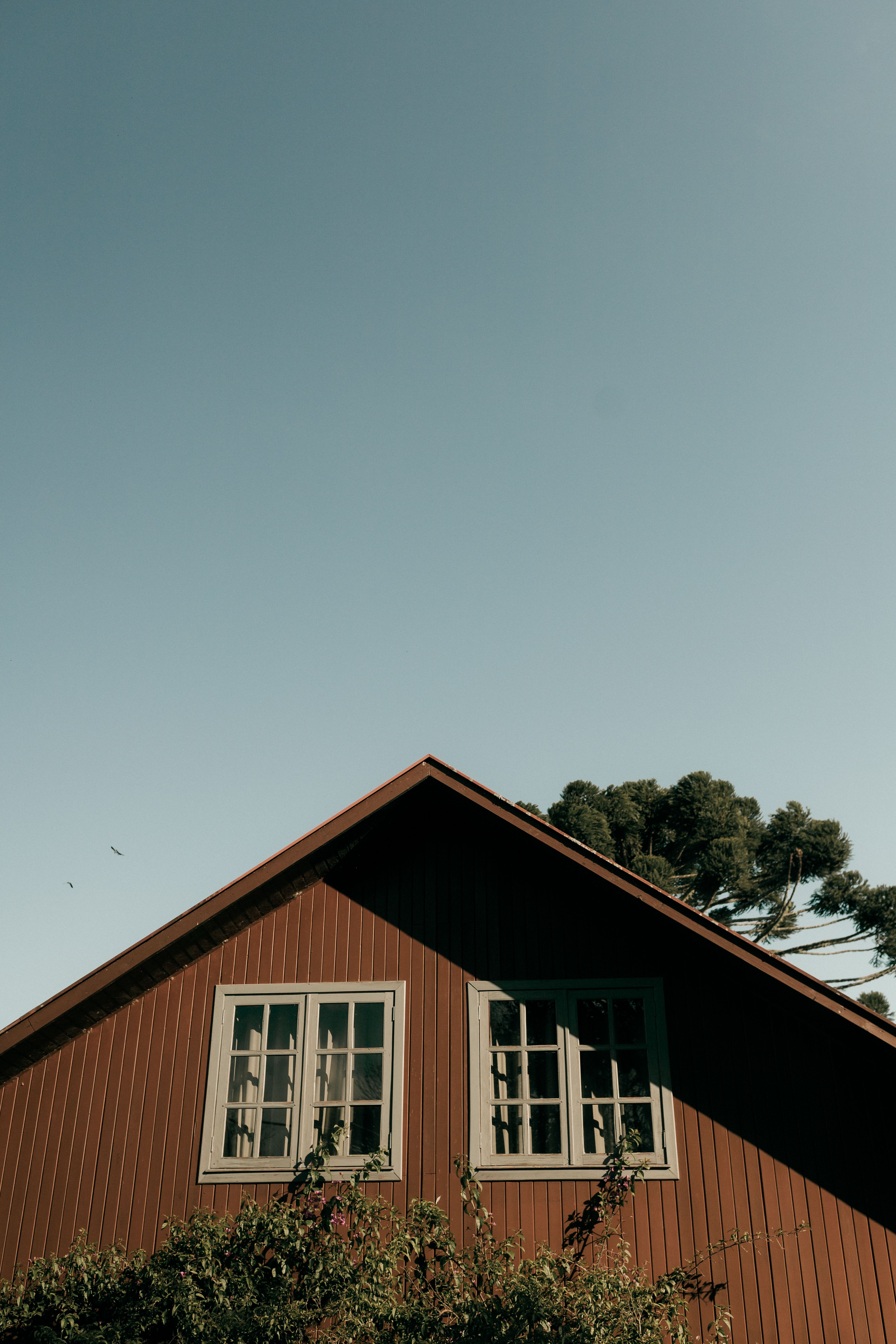 Rustic Wooden House Against Clear Blue Sky · Free Stock Photo