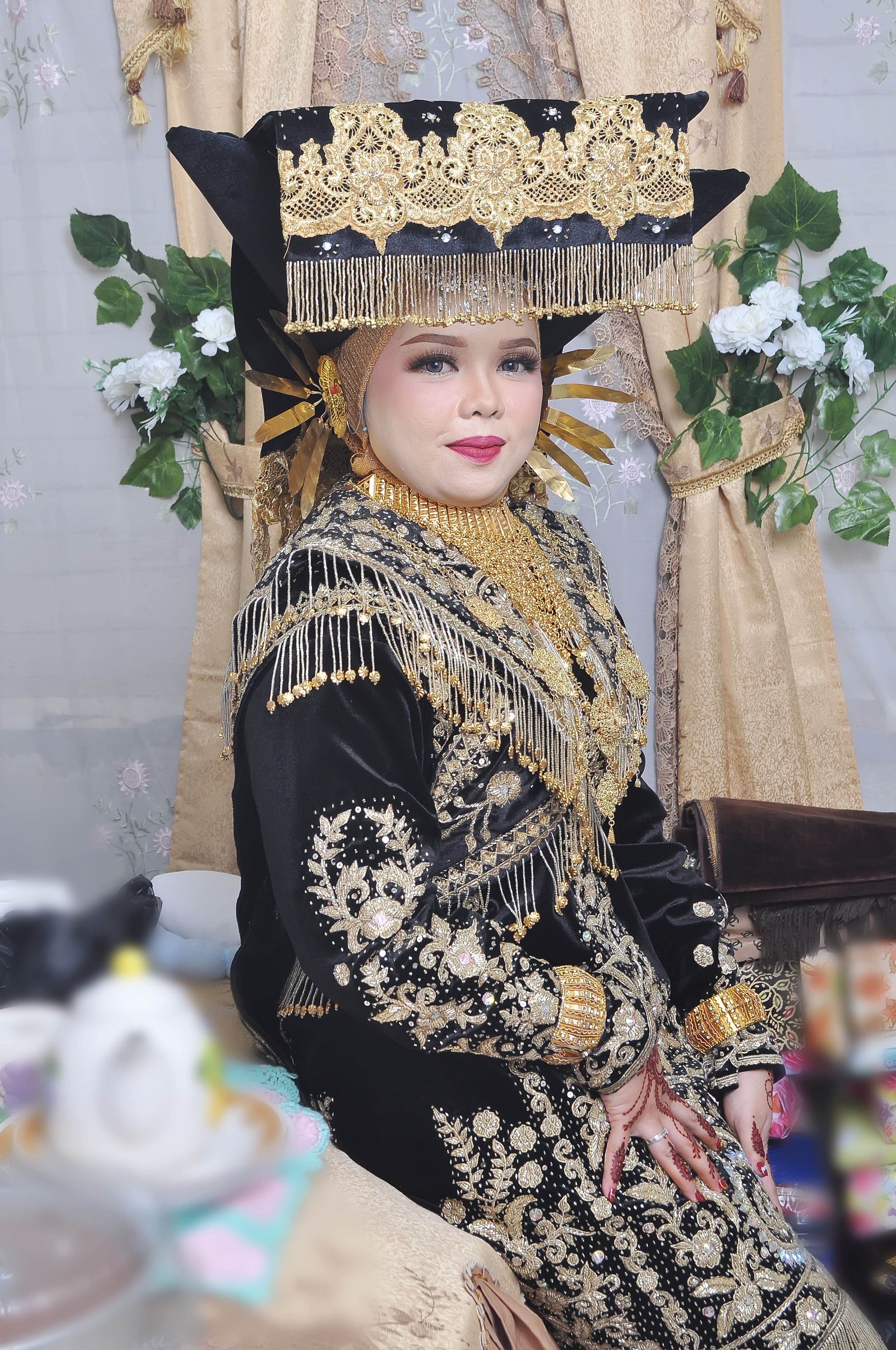 Woman in Traditional Gold and Black Attire