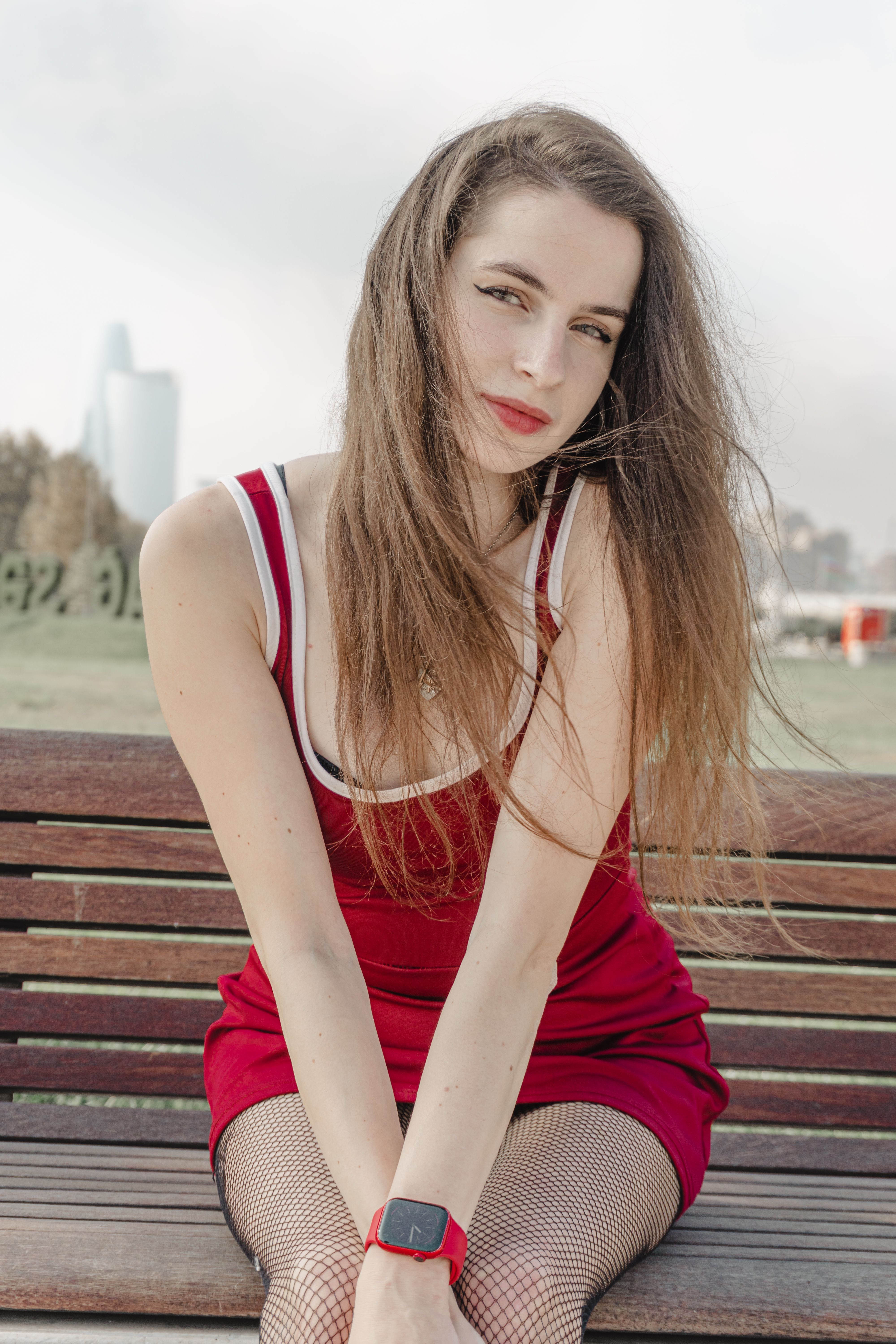 Young Woman in Red Dress on Park Bench · Free Stock Photo