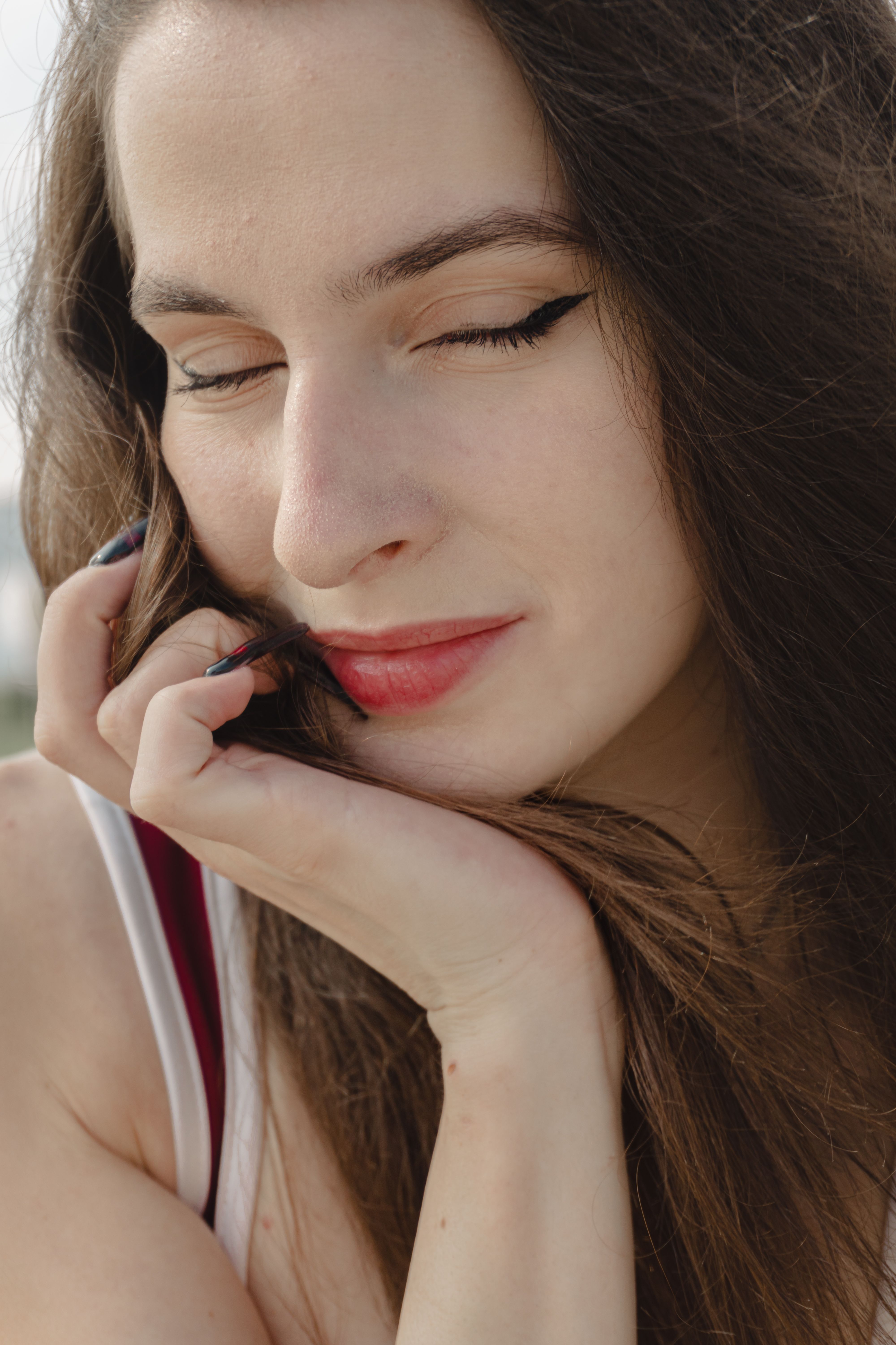 Close-up Portrait of a Relaxed Woman Outdoors · Free Stock Photo