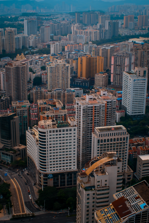 Free High-angle photo of dense urban landscape with towering skyscrapers at dusk. Stock Photo