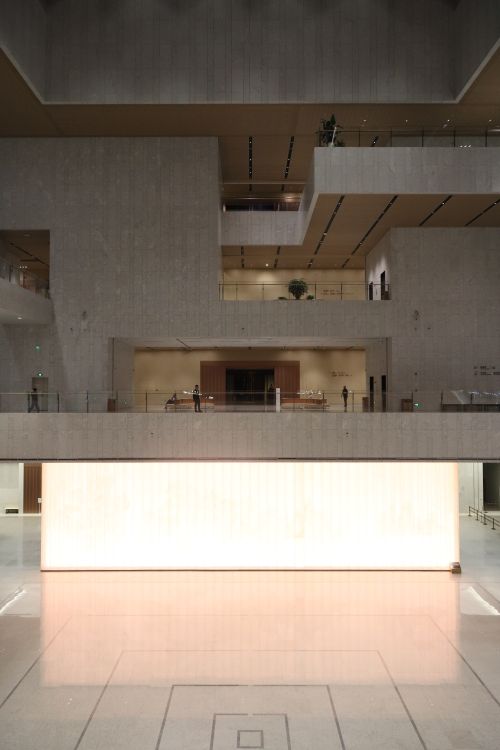Free Spacious modern atrium interior with minimalistic design and lighting. Stock Photo