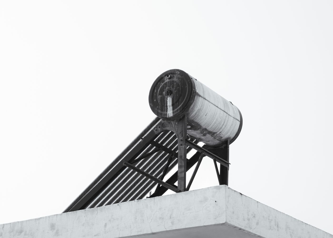 Solar water heating system installed on a rooftop in Telangana