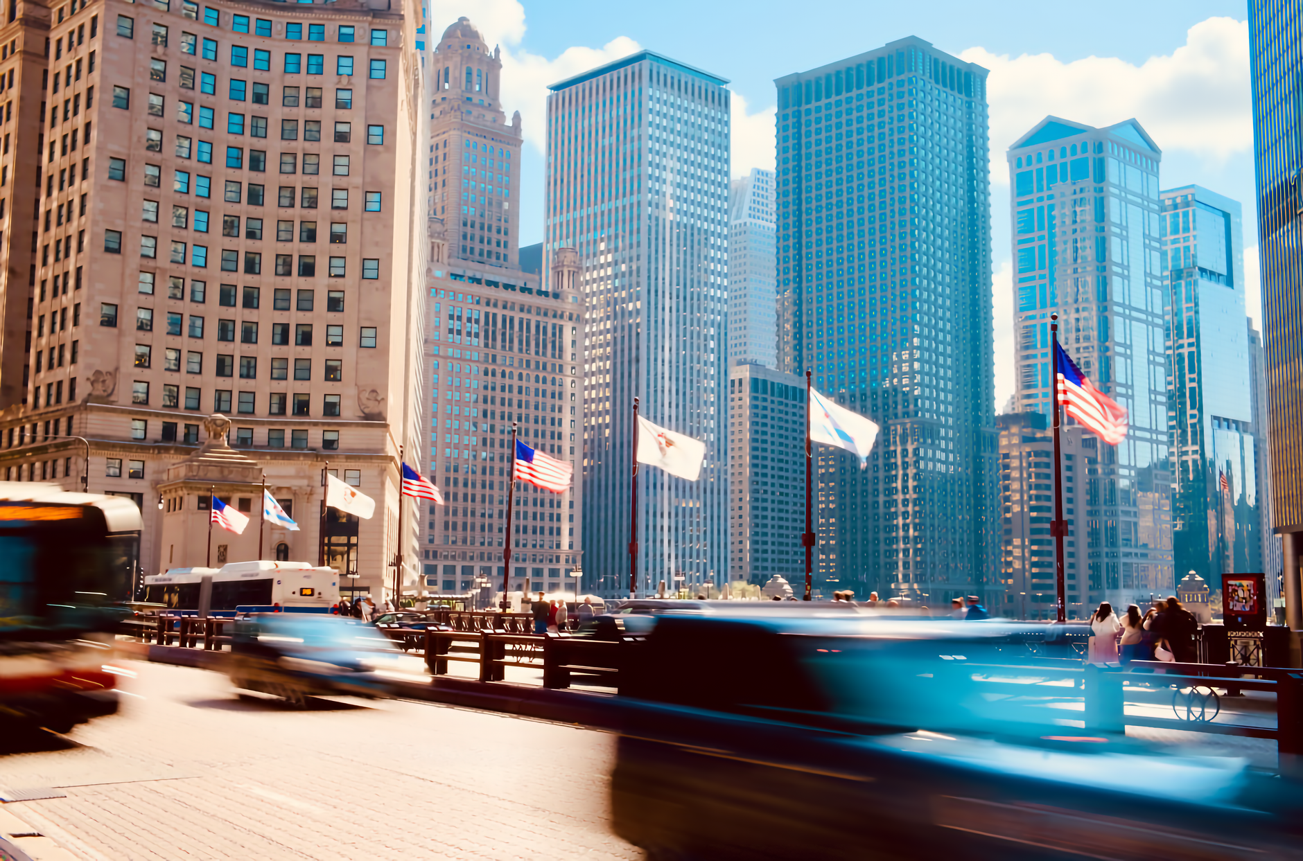 Vibrant cityscape of Chicago featuring bustling street activity and iconic skyscrapers on a sunny day.
