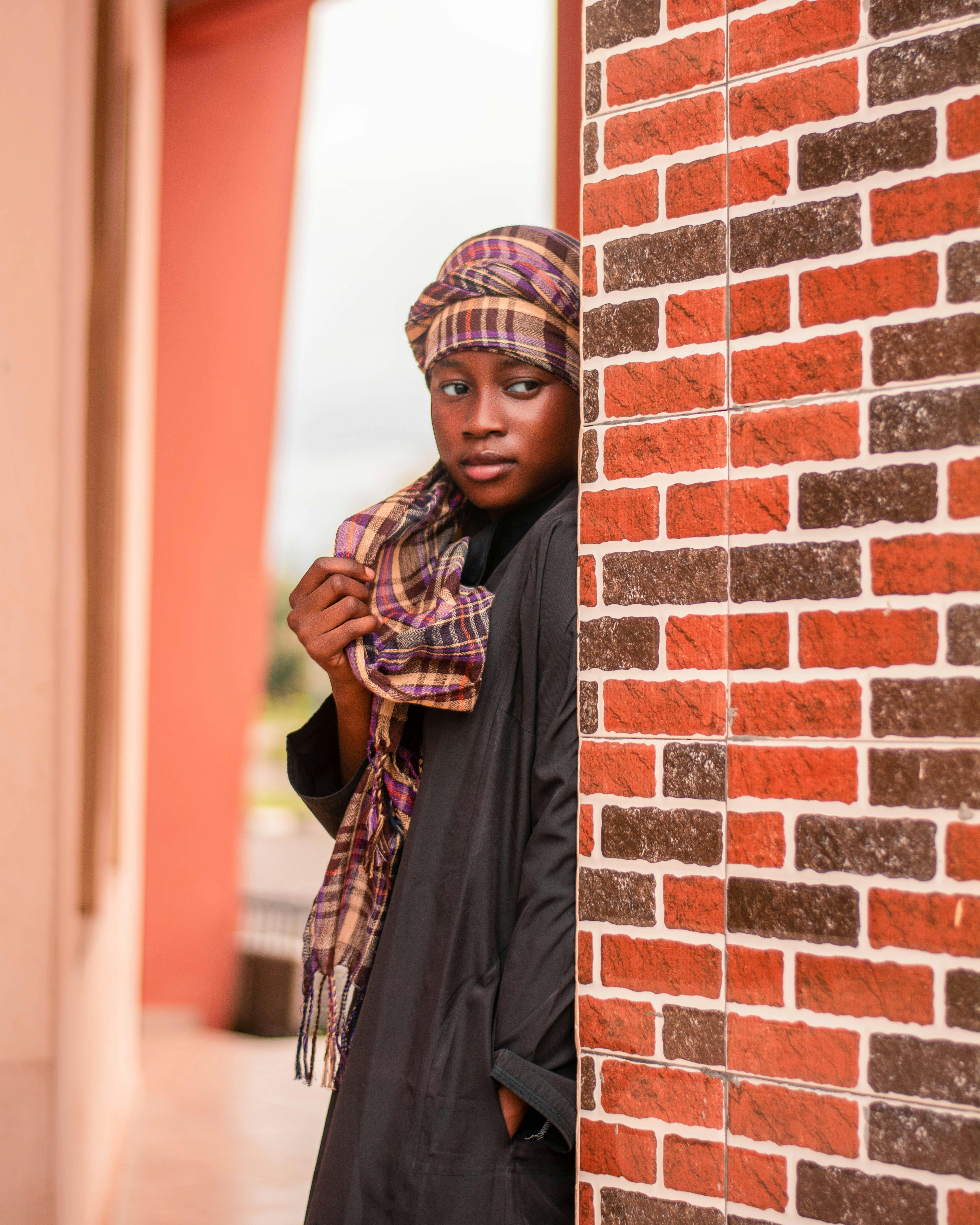 Free A young woman in Nigeria poses in traditional attire, reflecting culture and beauty. Stock Photo