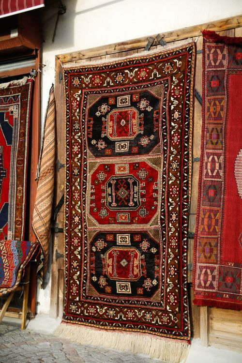Free Colorful traditional Turkish carpets hanging outdoors, showcasing intricate patterns. Stock Photo