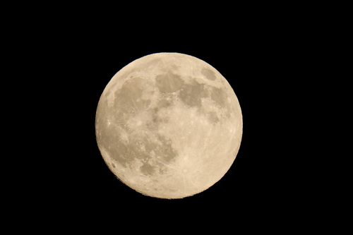 Free Captured in Darien, Connecticut, this striking image showcases a brilliant full moon against a deep black sky. Stock Photo
