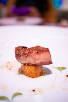 Close-up of an elegantly plated gourmet dish, showcasing culinary artistry.