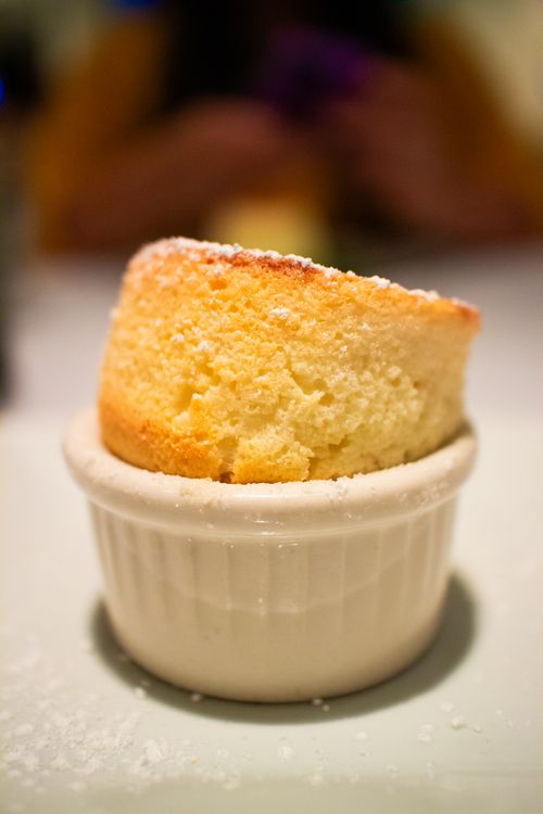 Free A delectable golden soufflé presented in a white ceramic ramekin, highlighting its perfect rise. Stock Photo