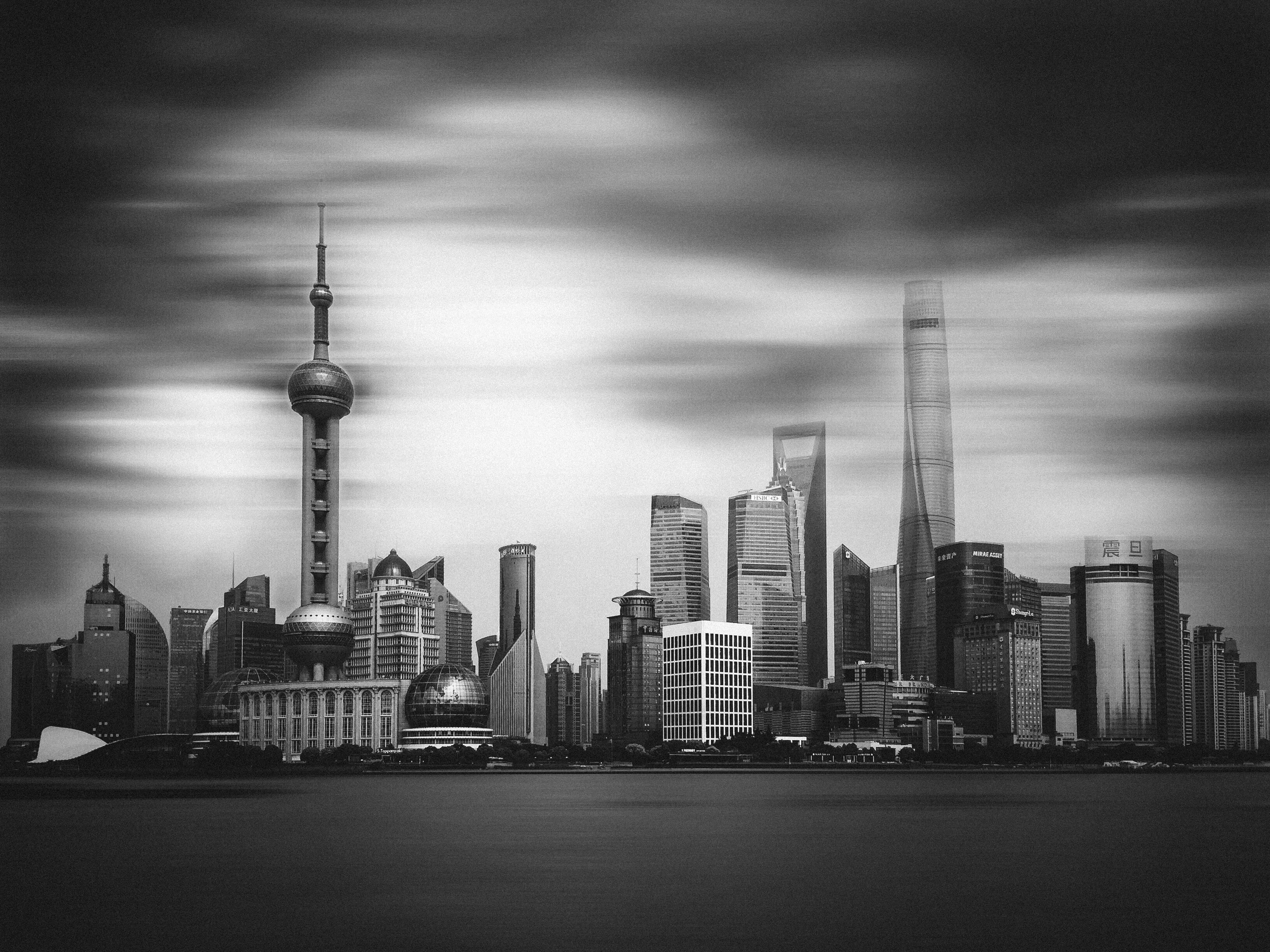 Captivating black and white view of Shanghai's skyline featuring modern skyscrapers.