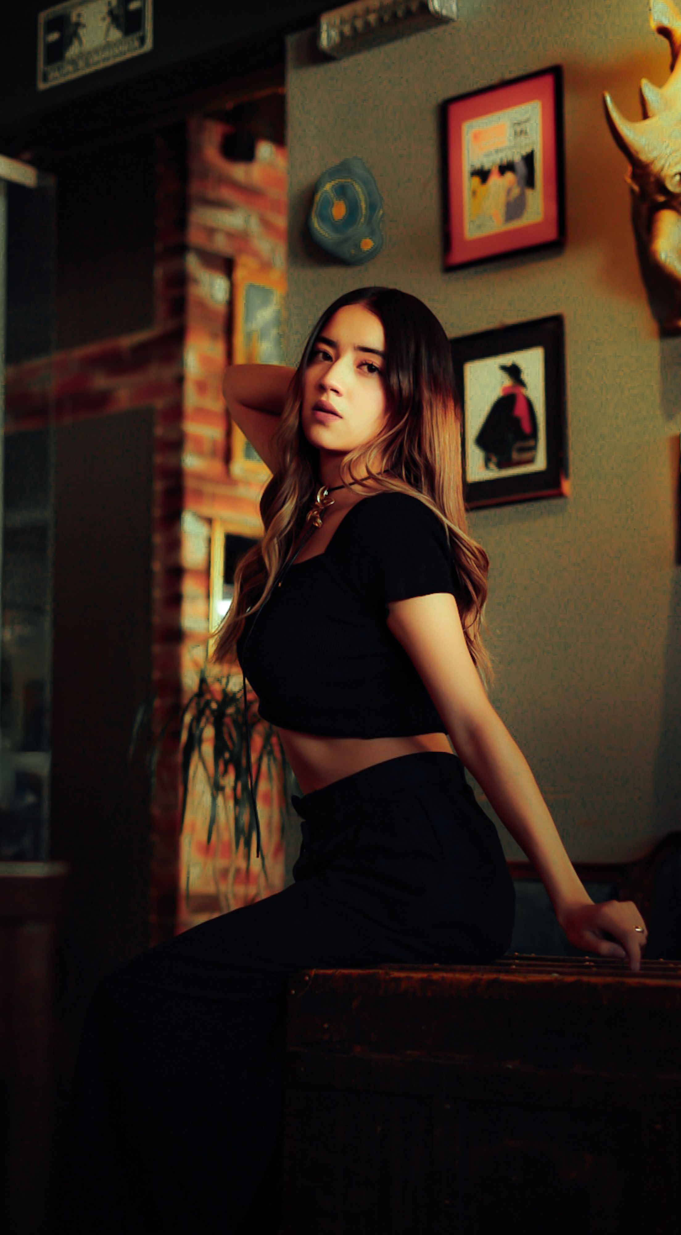 Stylish Woman Posing in Atmospheric Setting · Free Stock Photo