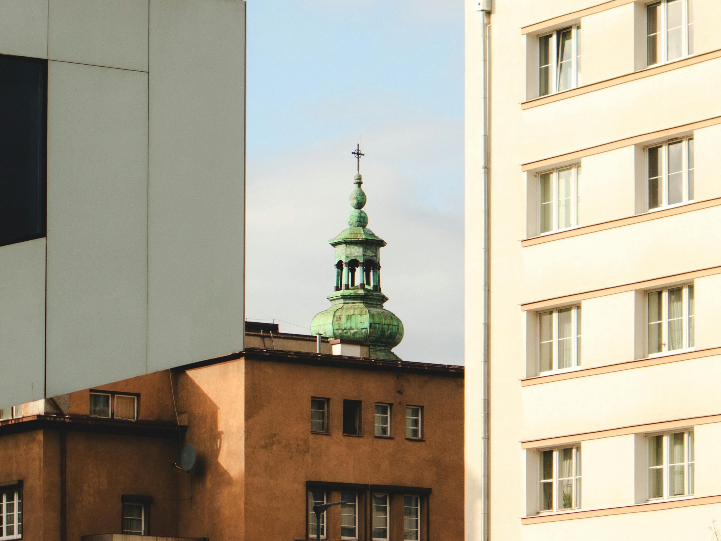 View of Gdynia's modern and historic architecture with a prominent church spire.