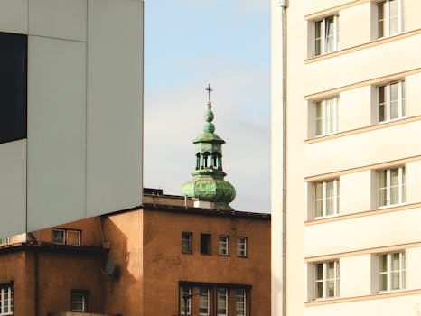 View of Gdynia's modern and historic architecture with a prominent church spire.