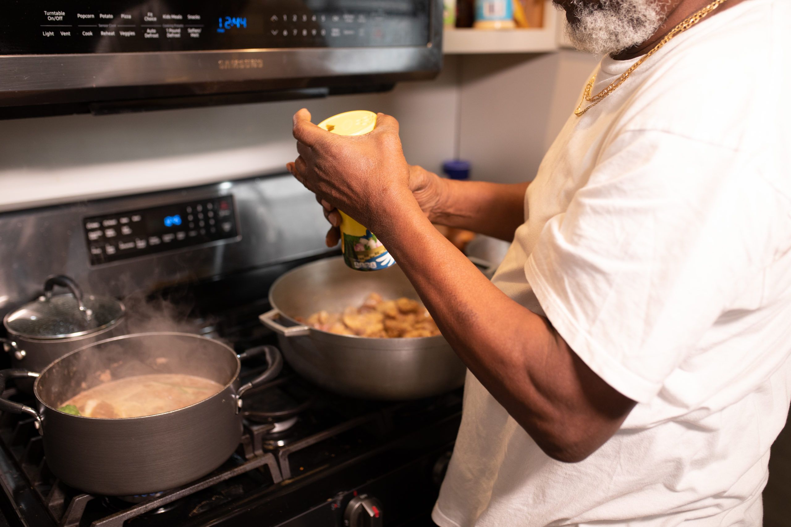 A man cooking a balanced meal at home as part of managing stress and heart health