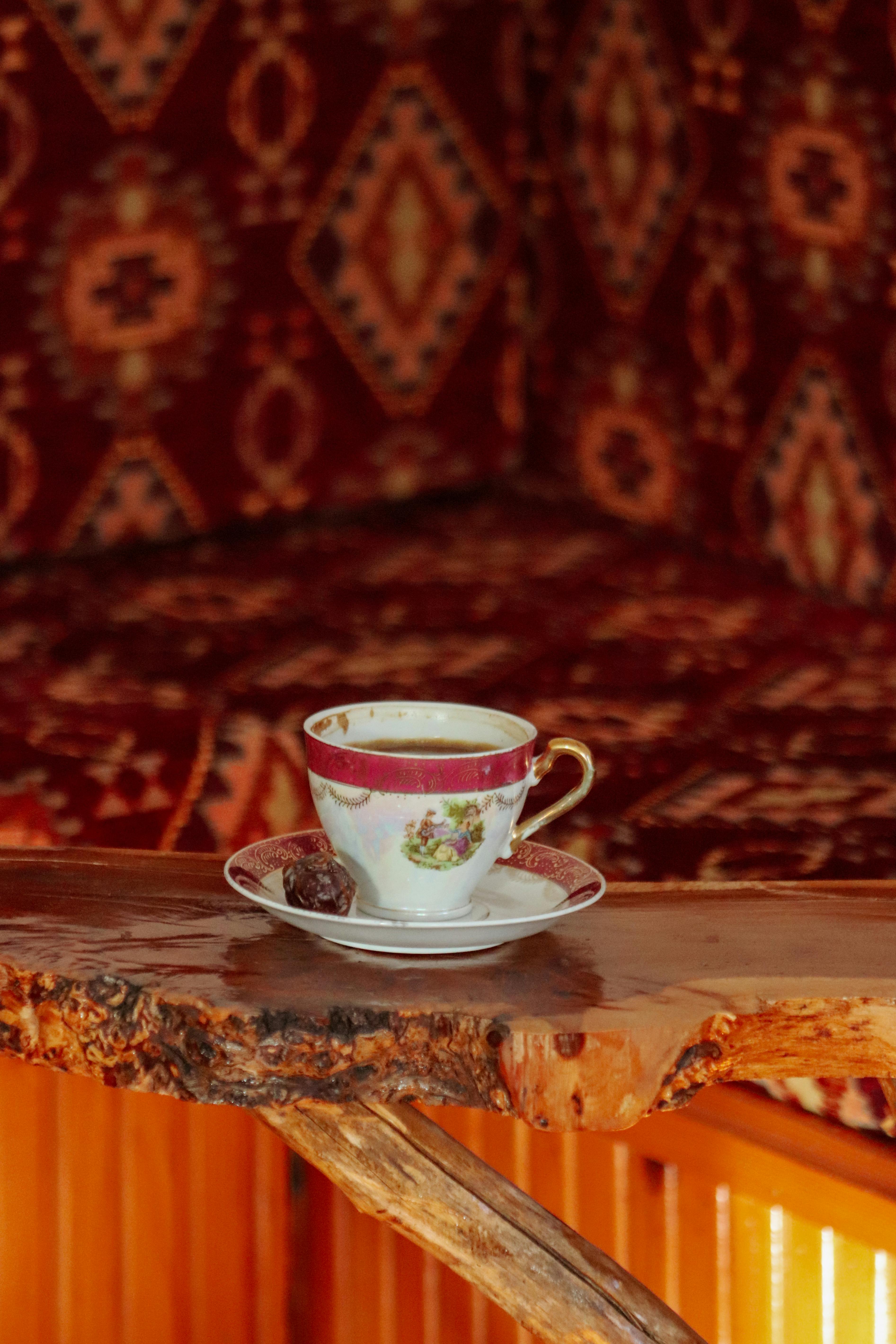Tea in a Cup on a Traditional Rug · Free Stock Photo