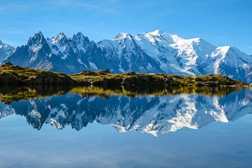 Free Breathtaking reflection of Mont Blanc in a tranquil lake at Chamonix-Mont-Blanc. Stock Photo