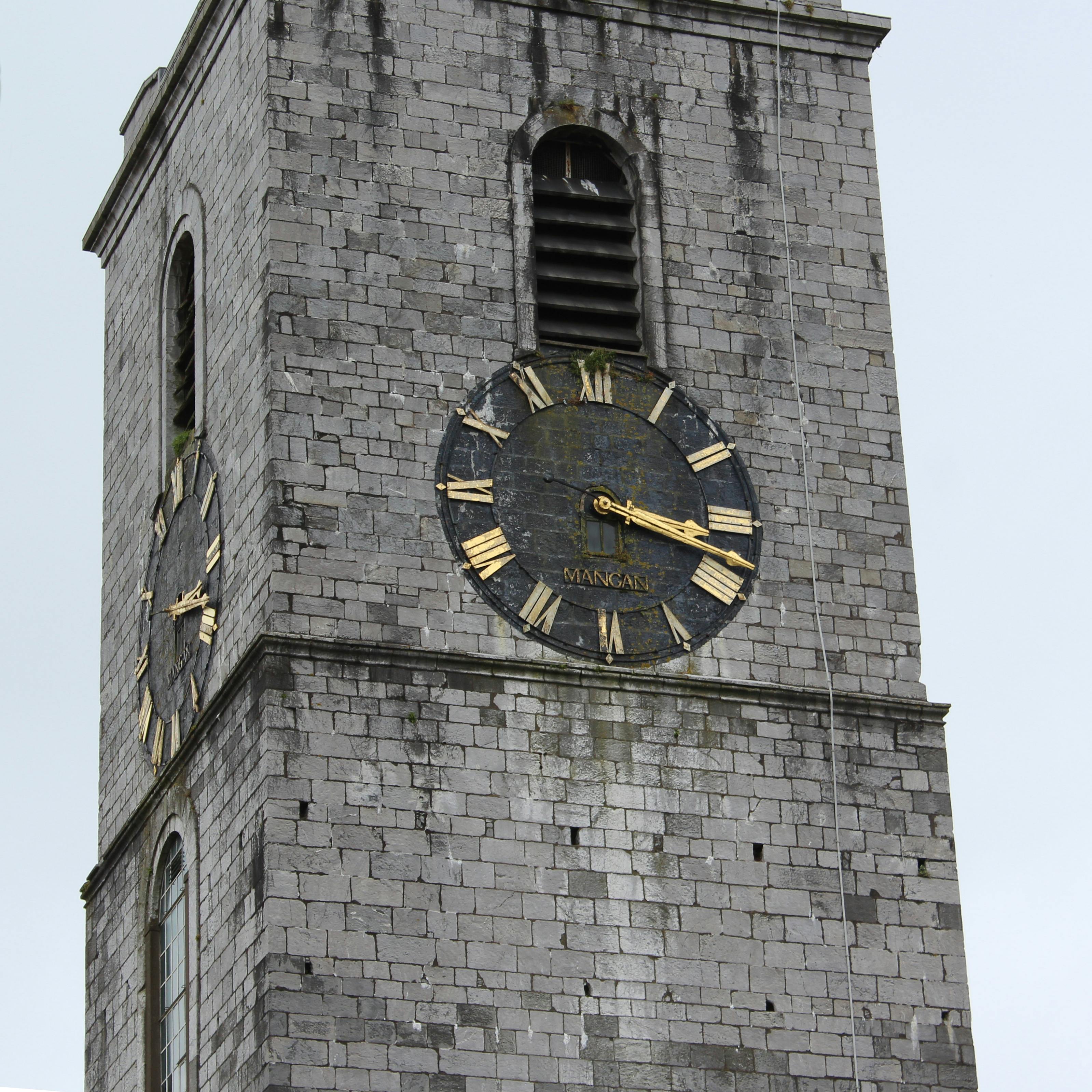 Close-up of the historic clock tower at St. Anne's Church in Cork, Ireland.