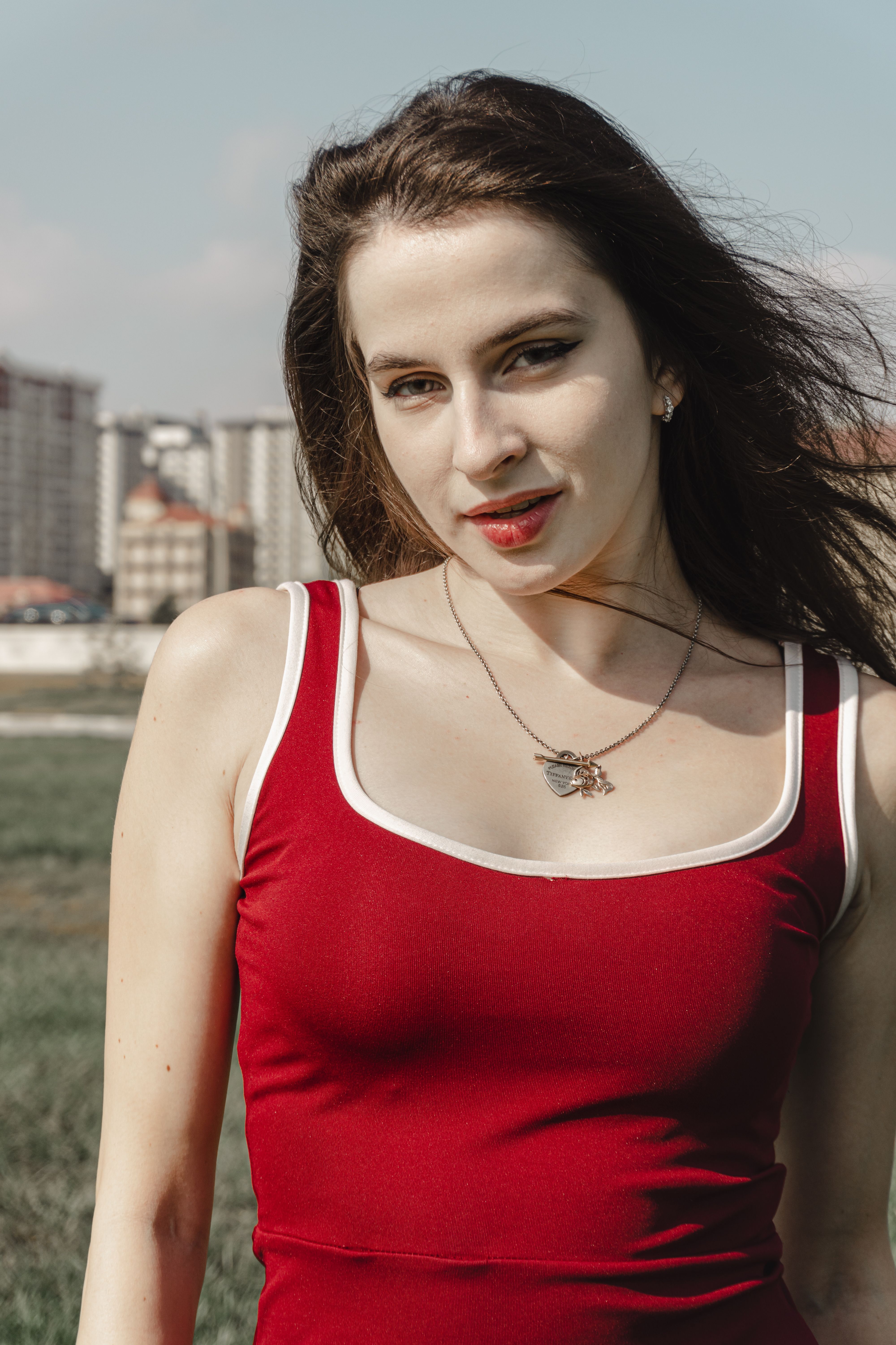 Young Woman in Red Dress Outdoors · Free Stock Photo