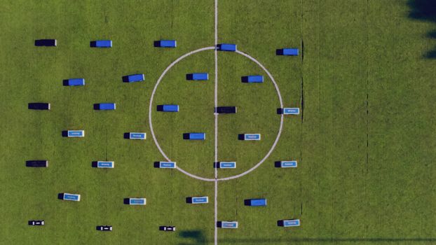 Top-down view of football field setup with benches. Abuja, Nigeria.