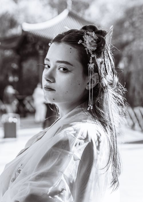 Free Woman in traditional Asian dress with a serene expression in black and white. Stock Photo