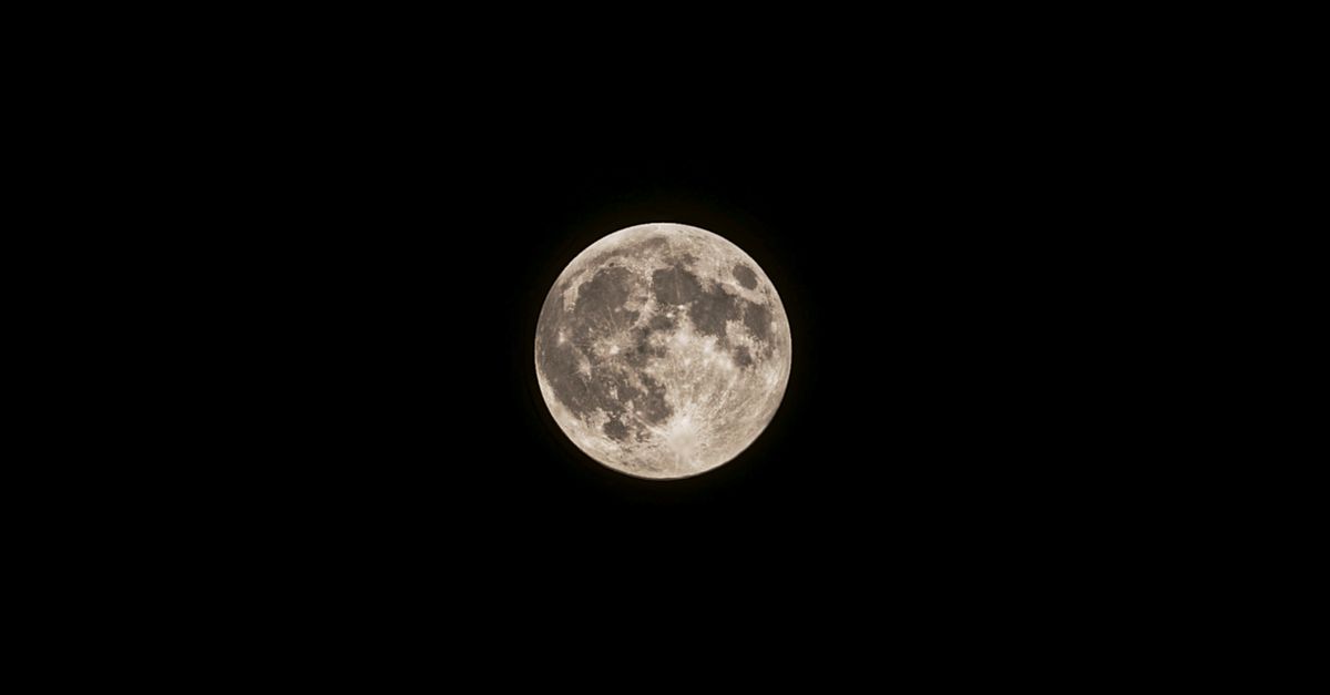 A captivating full moon against a black night sky captured in detail.