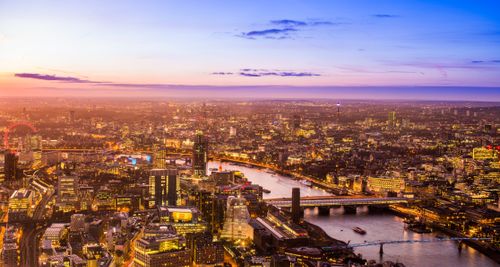 Free A breathtaking aerial view of London's skyline at sunset, featuring iconic landmarks. Stock Photo