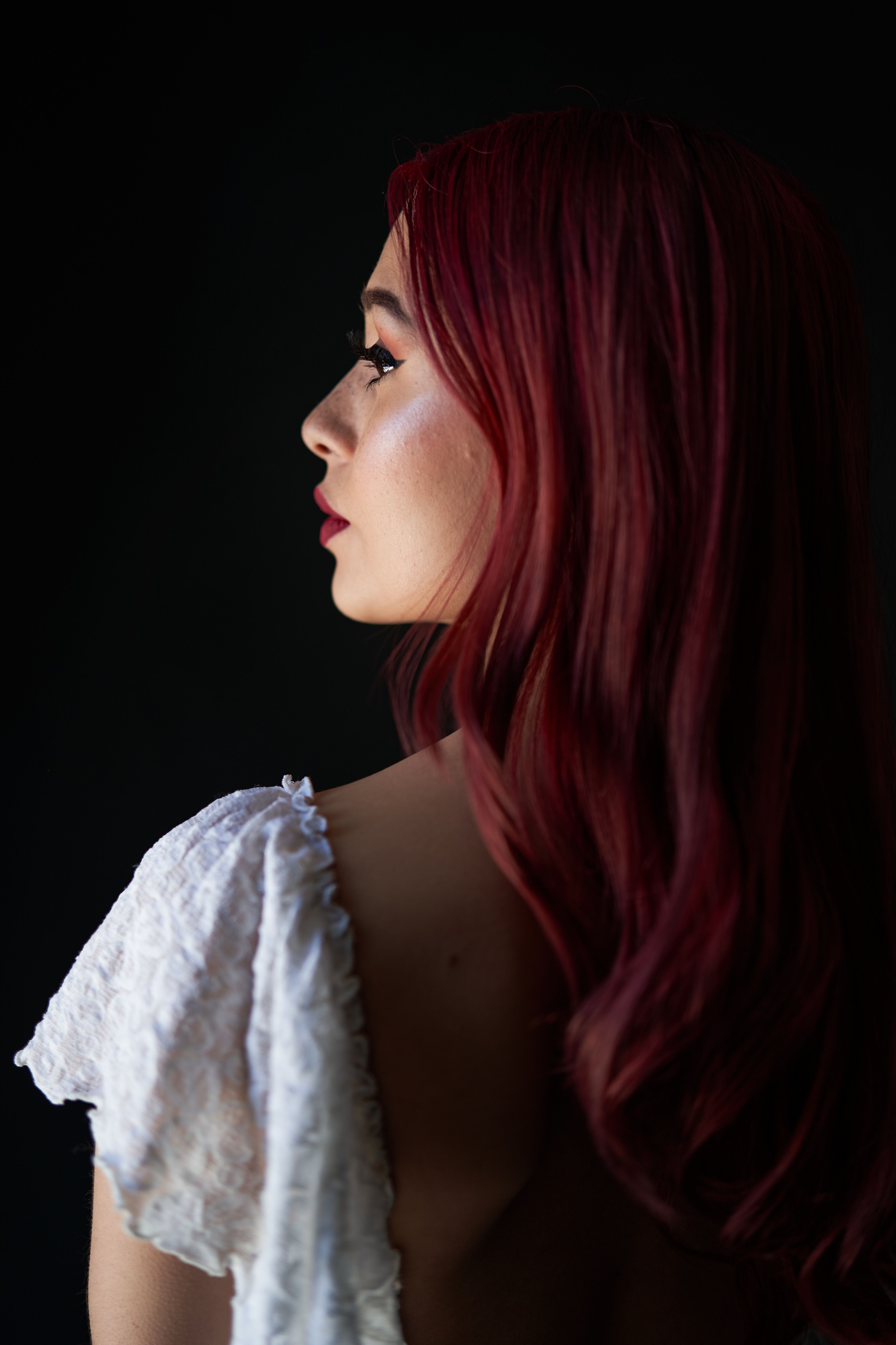 Elegant Profile of Woman with Red Hair · Free Stock Photo